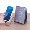HonestWaves - PortableCharge 6 - Phone Charging Station in Black - Hand holding phone charging Hand holding phone while charging with PortableCharge 6 by HonestWaves