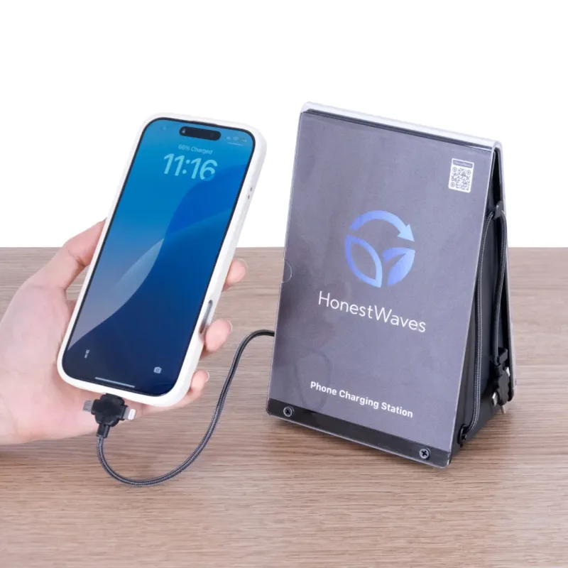 HonestWaves - PortableCharge 6 - Phone Charging Station in Black - Hand holding phone charging Hand holding phone while charging with PortableCharge 6 by HonestWaves